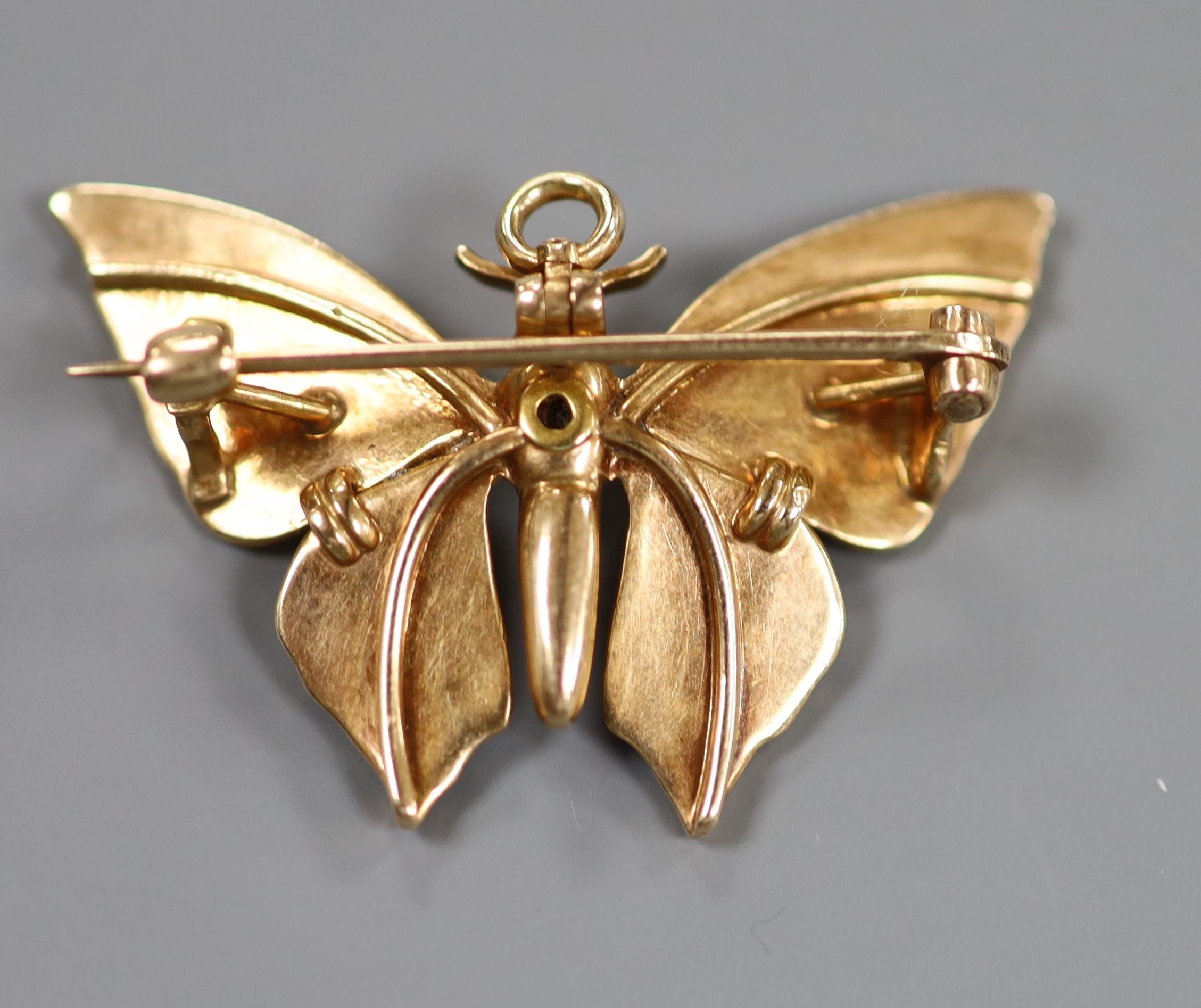 A yellow metal, enamel and split pearl set butterfly pendant brooch (enamel a.f.), 35mm, gross weight 6 grams.